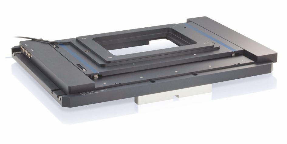 Very flat microscopy stage without any interfering lead screw ducts or motor protrusions Very flat microscopy stage without any interfering lead screw ducts or motor protrusions