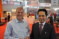 Terry Kawashima (right), Managing Director of OKI Systems and Thomas Meurers, RGF Representative