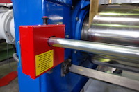Mixing mill with safety switch bar