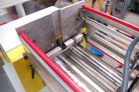 Laboratory mixing mill with safety cage.
