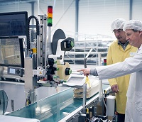 Labels are blown with a strong air blast onto packages. Labels are blown with a strong air blast onto packages.