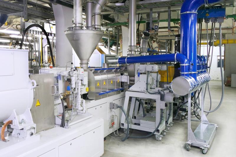 The two side dispensing units on the twin screw extruder