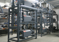 Central vacuum system for supplying a large woodworking plant with vacuum