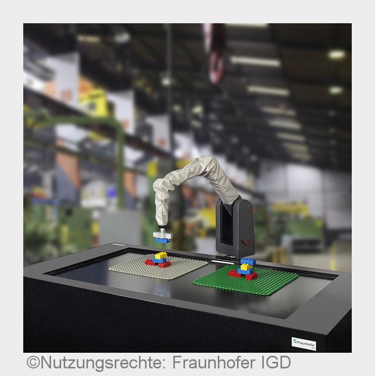 Der DUPLOcator erkennt via Kameras geformte Strukturen und baut diese mit einem Roboterarm nach. (Bi Der DUPLOcator erkennt via Kameras geformte Strukturen und baut diese mit einem Roboterarm nach. (Bi