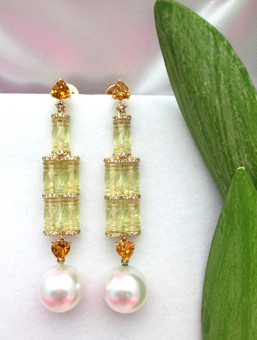 Außergewöhnliche Ohrringe mit Diamanten, Citrinen und an Bambuselemente erinnernden Quarzsteinen. Fo Außergewöhnliche Ohrringe mit Diamanten, Citrinen und an Bambuselemente erinnernden Quarzsteinen. Fo