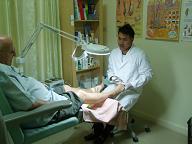 Podologist Wuttipong treats a patient in the Clinic in Chiang Mai