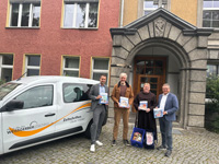 Maurice Hettling, Bernd Backhaus, Bruder Christoph Körper ofm und Andreas Haase bei der Übergabe