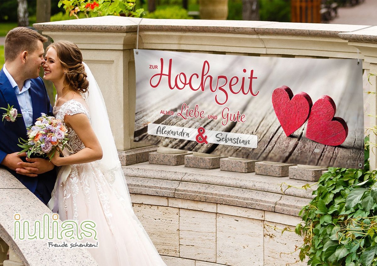 Mit einem Hochzeitsbanner von iulias.de liebevolle Glückwünsche verschenken (© iulias verlag + Adobe Stock (Angelov))