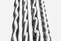 Bei dem neuen inneren Wärmetauscher FIT von Eaton wird das Innenrohr in eine Helix-Struktur umgeform Bei dem neuen inneren Wärmetauscher FIT von Eaton wird das Innenrohr in eine Helix-Struktur umgeform