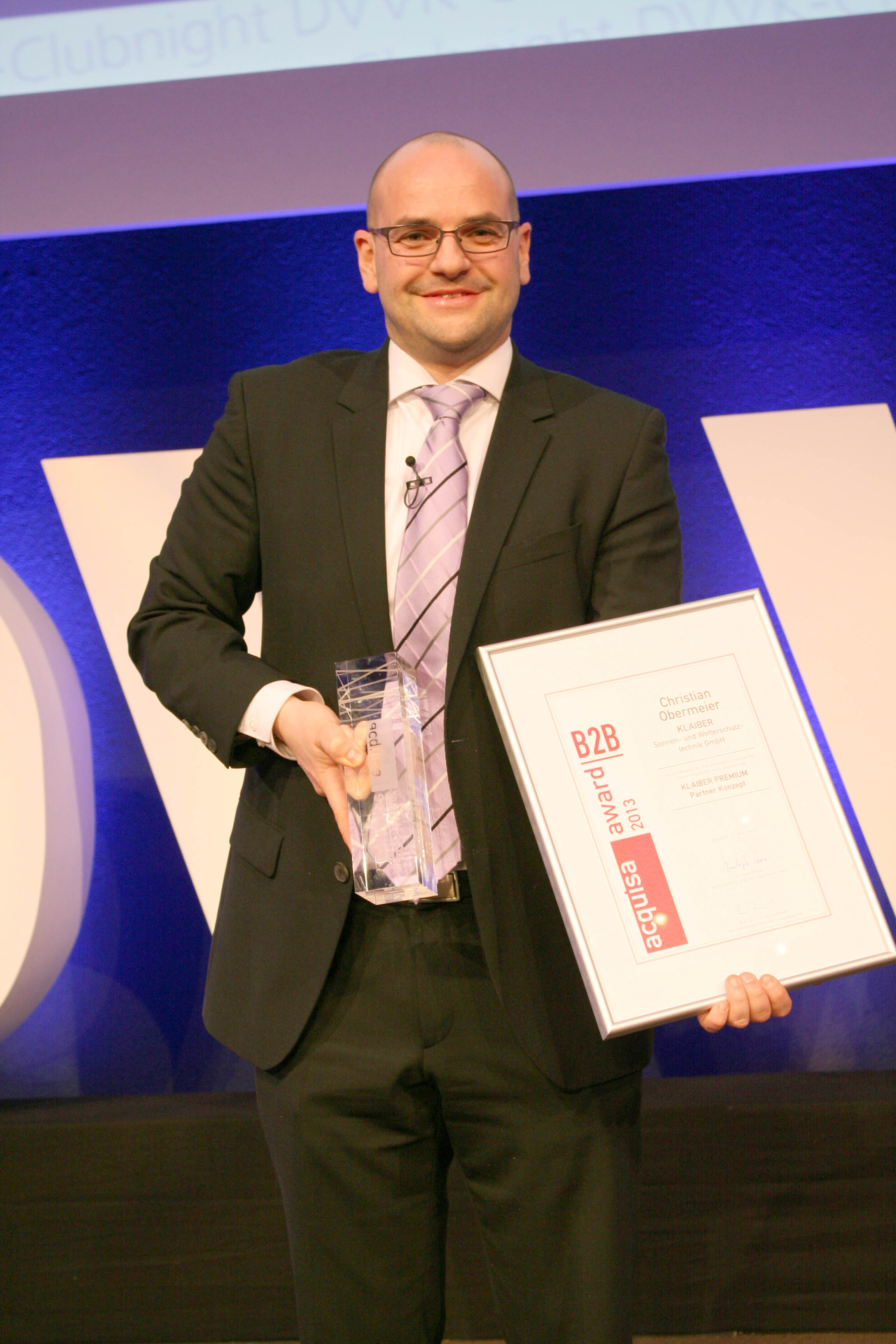 Christian Obermeier, Leiter Vertriebsmarketing, bei der Preisverleihung des acquisa Awards.