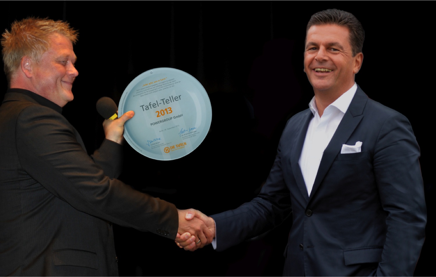 Jochen Brühl, Vorsitzender des Bundesverbands Deutsche Tafel e.V., bedankt sich bei Honorarkonsul Dr